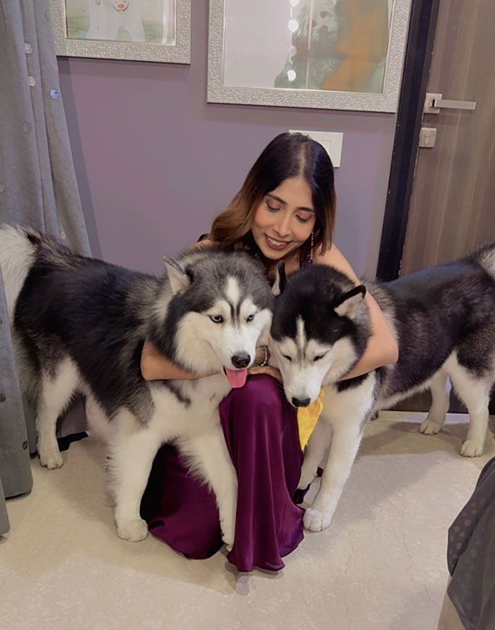 Krishna with her Huskies